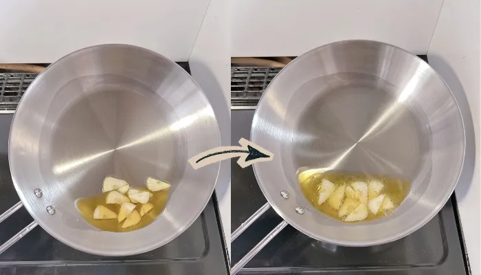 ステンレスフライパンにオリーブオイルとニンニクが入っている画像