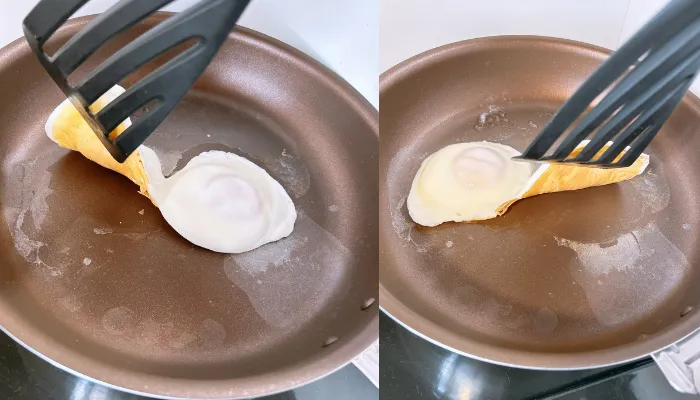 PENTAフライパンで焼いた目玉焼きをヘラで持ち上げる様子